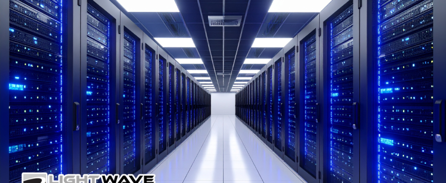 Looking down a data center with IT hosting and servers in a secure space.